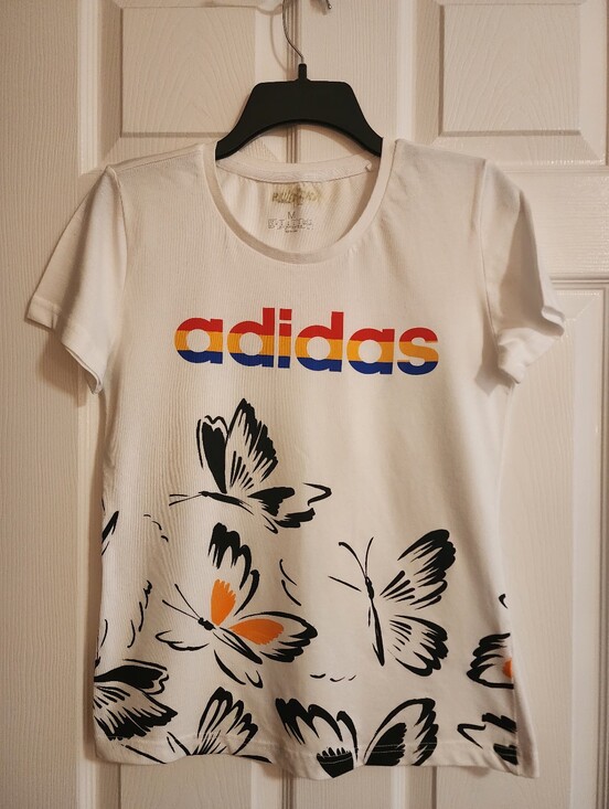 adidas Tops - adidas White Tee with Multicolor Logo and Black Butterfly Print